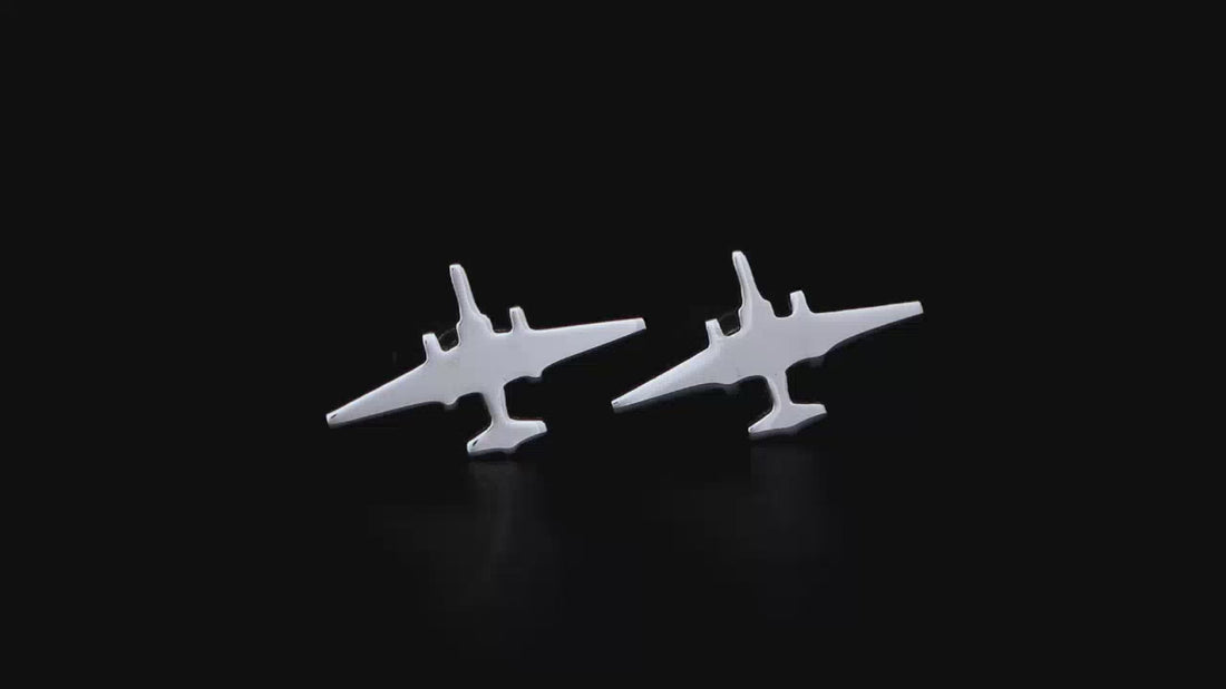 sterling silver U-2 cuff links on a turntable with a black background