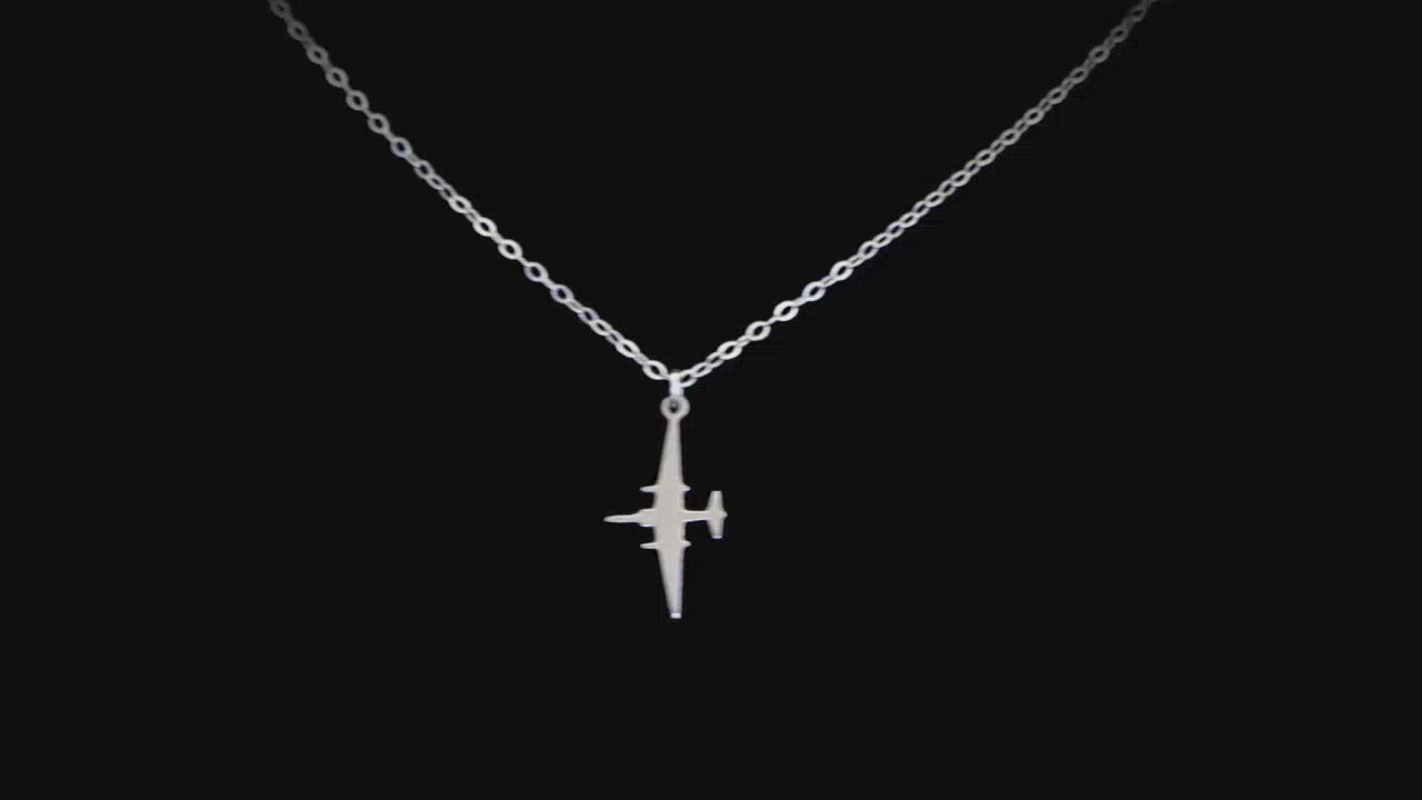 U-2 Dragon Lady military jet pendant necklace in sterling silver, displayed against a black background.