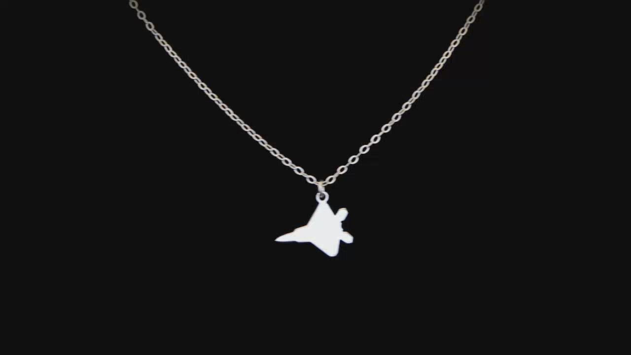 Load video: Image of a Sterling Silver C-130 Airplane Pendant going back and forth on a turntable