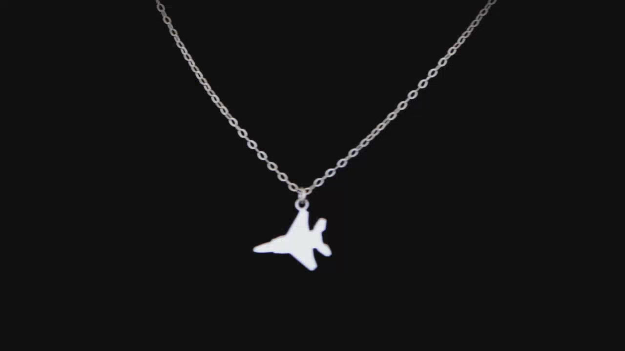 Video of a F15 Eagle necklace on a black background