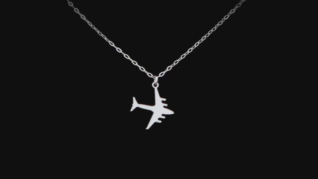 sterling silver C-17 jet necklace in a black background