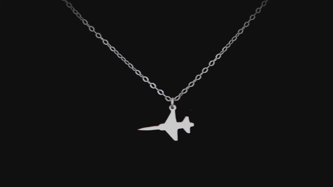 Load video: Image of a Sterling Silver F-5 Freedom Fighter Jet  Airplane Pendant going back and forth on a turntable