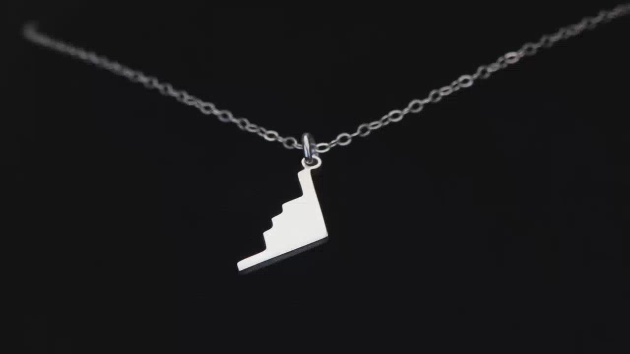 Load video: Image of a Sterling Silver B-2 Spirit Bomber Pendant going back and forth on a turntable