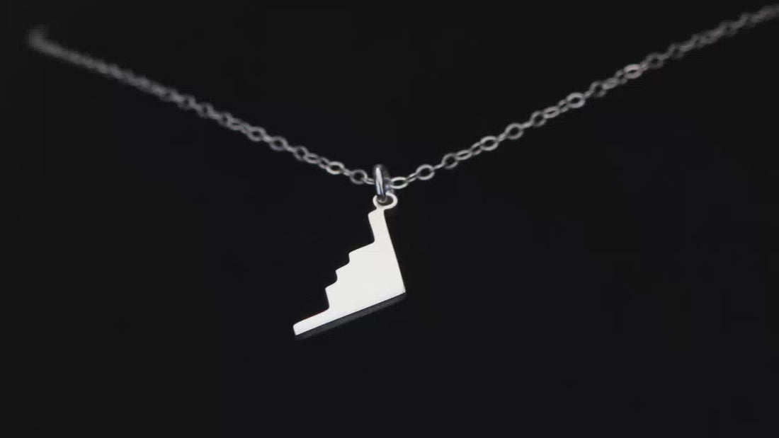 B2 Bomber Military Aircraft Silver Pendant Necklace going back and forth on a turntable
