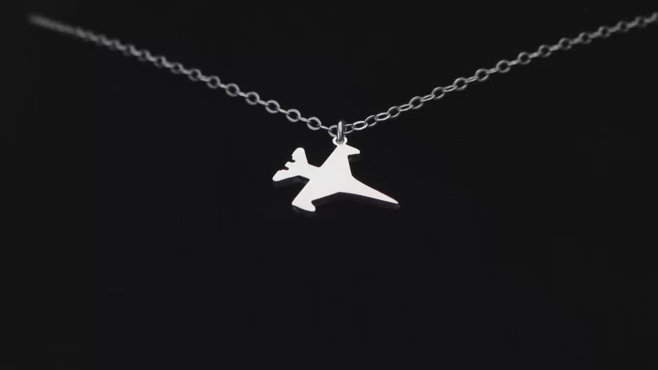 Load video: Image of a Sterling Silver C-130 Airplane Pendant going back and forth on a turntable