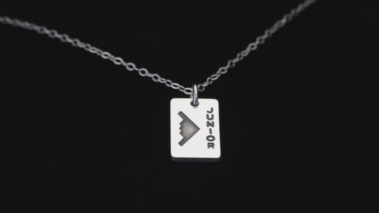 Load video: Image of a Sterling Silver B-2 Bomber Personalized Pendant going back and forth on a turntable