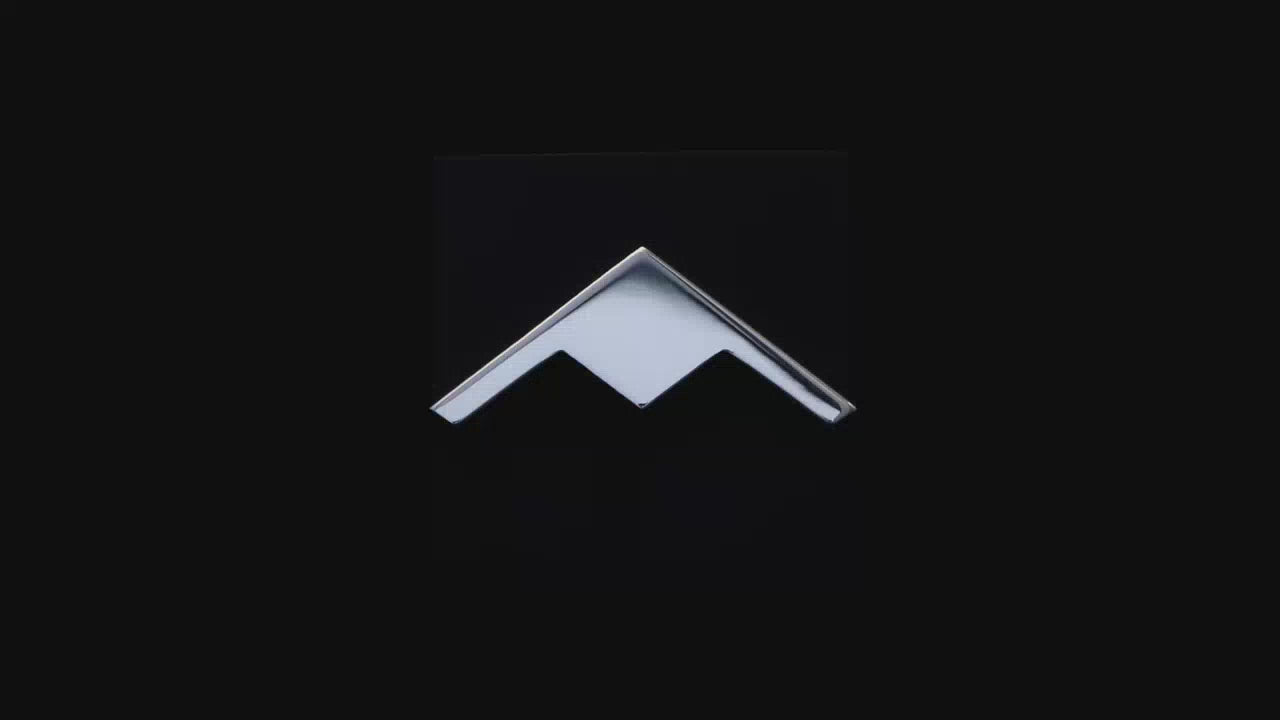 Load video: Sterling silver C-130 Hercules Tie Pin on a turntable with a dark background