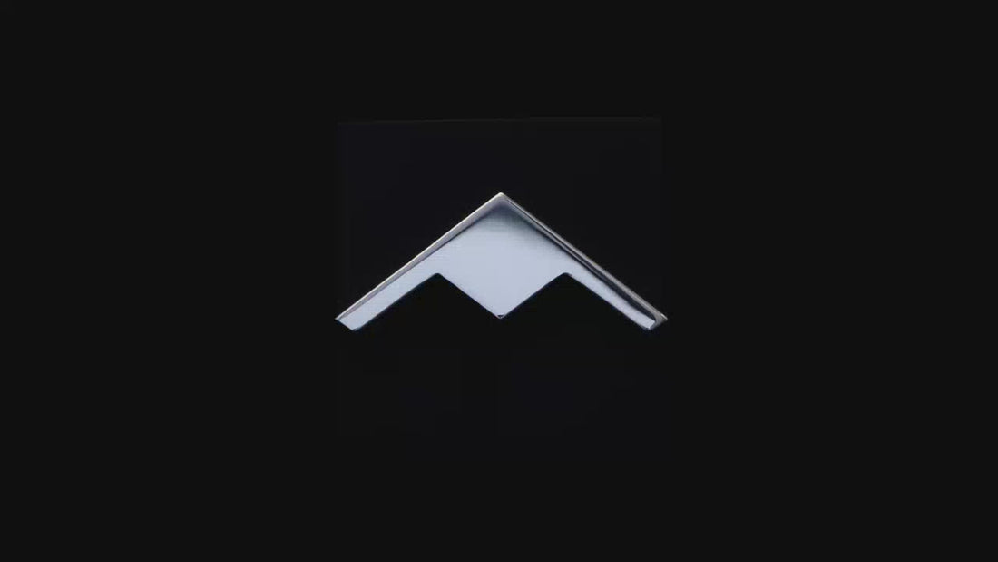 Silver B-21 Raider Bomber Military Jet Tie Pin against a dark background