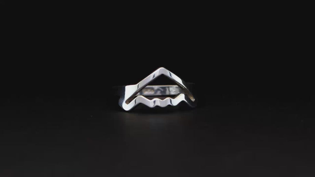 Silver B-2 Spirit Bomber Military Jet Ring on a black turntable