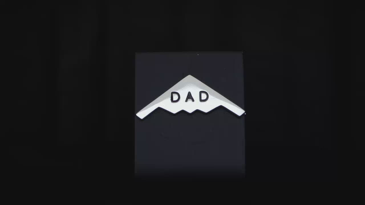 Load video: Sterling silver C-130 Hercules Tie Pin on a turntable with a dark background