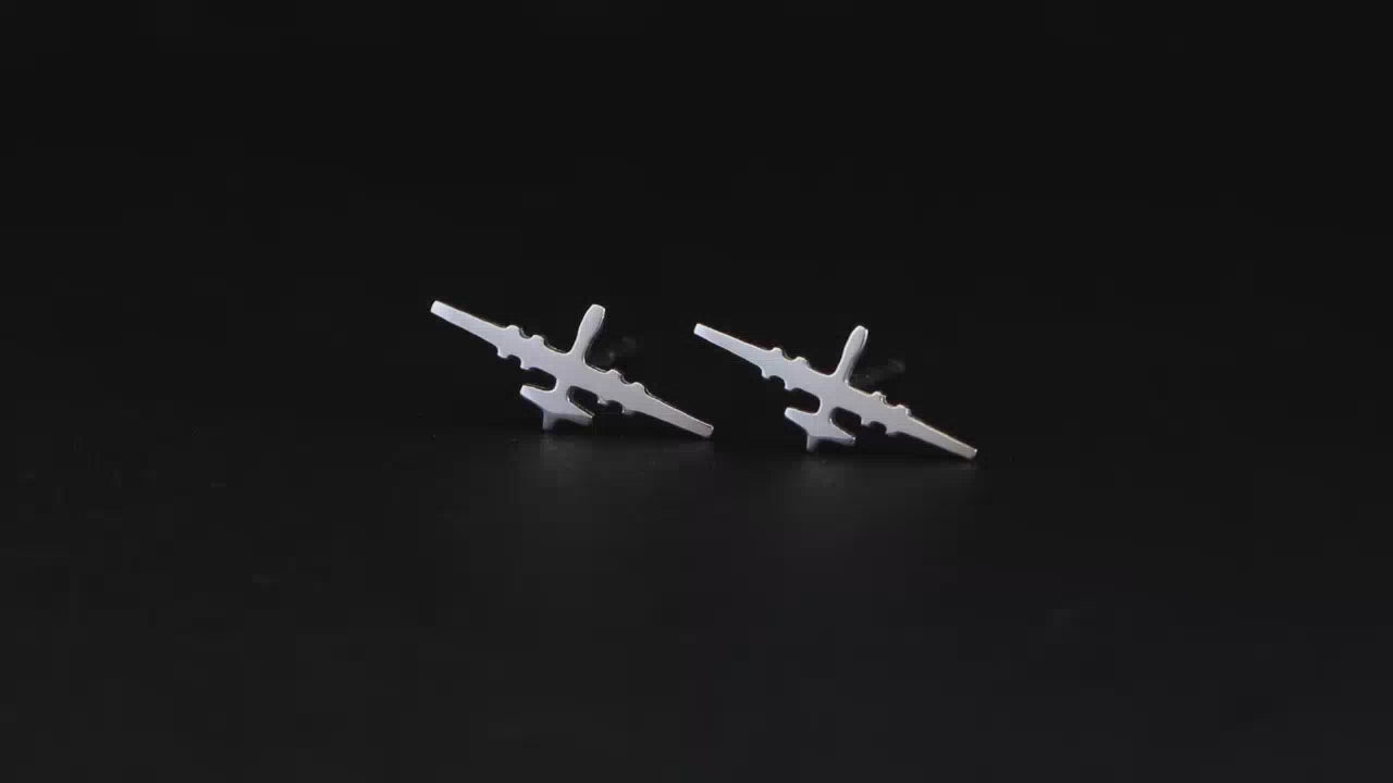 Load video: Pair of B-1 Lancer Jet Fighter Bomber Sterling Silver Stud Earrings on a turntable with a dark background