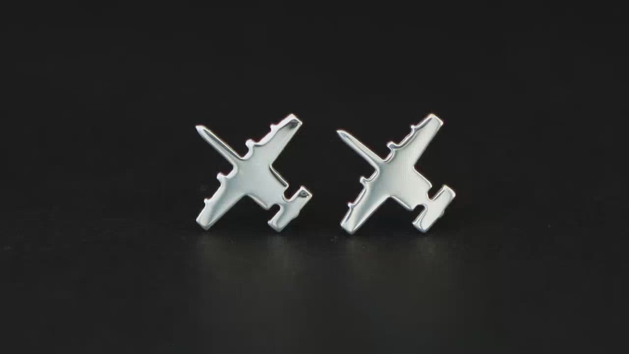 Load video: Pair of sterling silver A-10 Warthog Military Jet Stud Earrings on a turntable with a black background