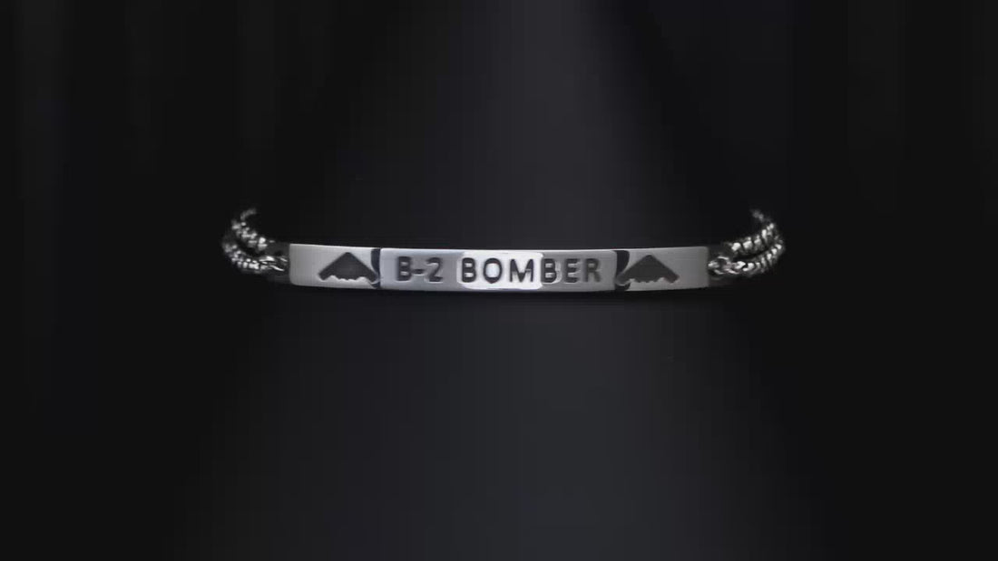 B-2 Bomber Engraved Silver bracelet on a turntable with a dark background